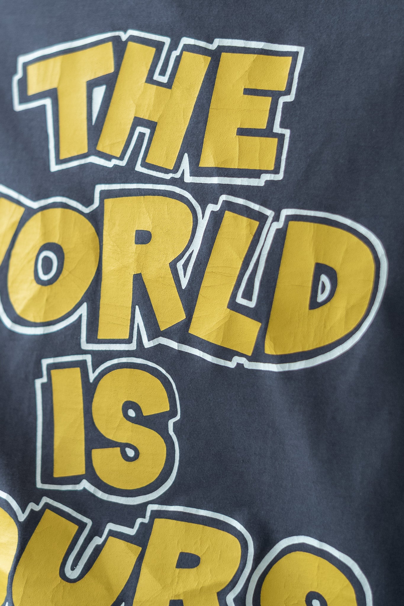 WORLD IS YOURS Tee-Cartoon Letter〔GRAY〕