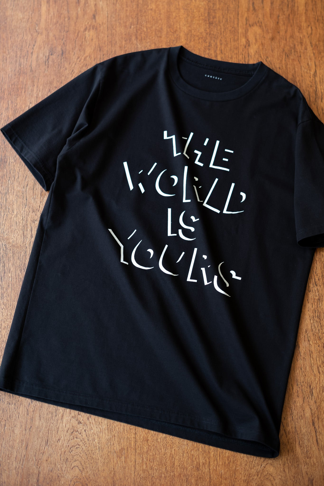 EX) WORLD IS YOURS Tee-Cartoon Letter〔BLACK〕